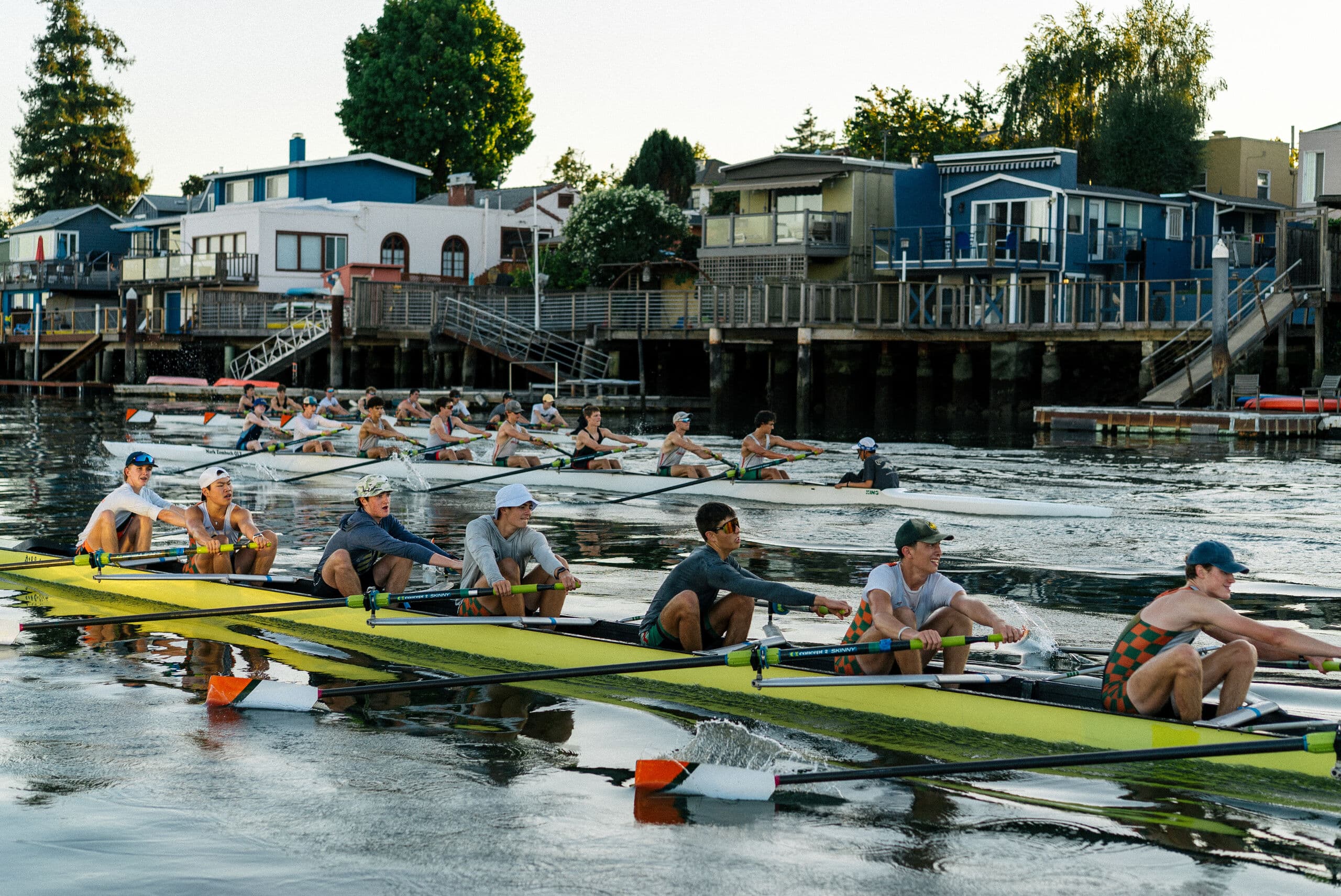Eights staged along the Tidewater dock, Estuary homes across the water